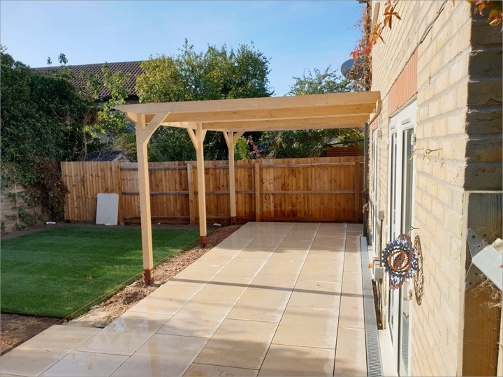 A freshly installed leon-to pergola over a customers patio